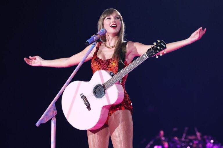 Catch the attention of Taylor Swift fans as a devoted superfan stuns in Billboard Hot 100 Top 14 cape at Paris concert!